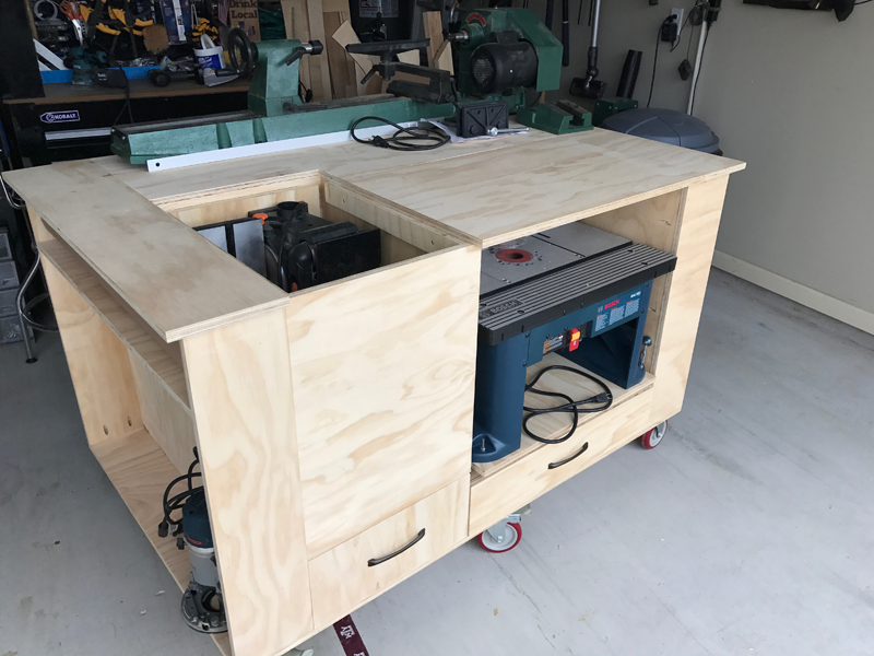 work bench with sander and router displayed