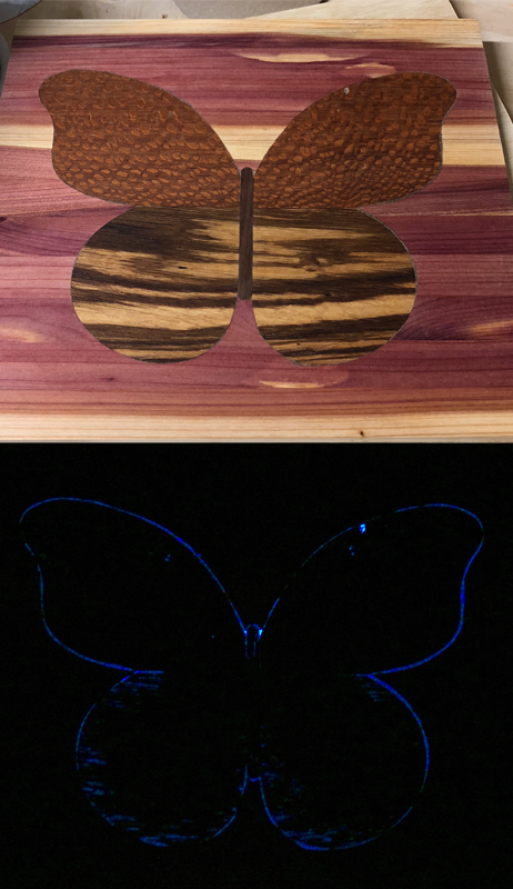 wood panel with cartoon butterfly