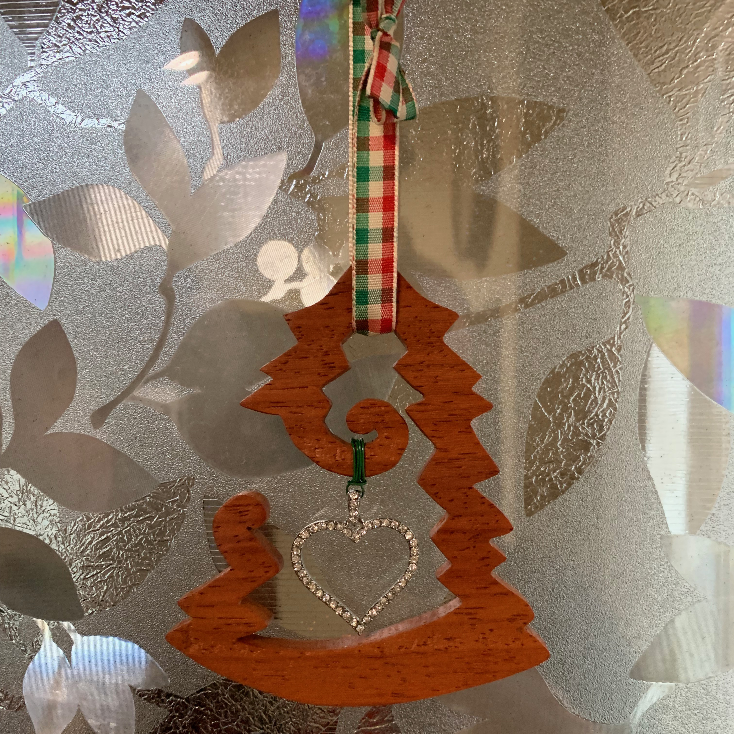Tree shaped christmas ornament with heart pendant